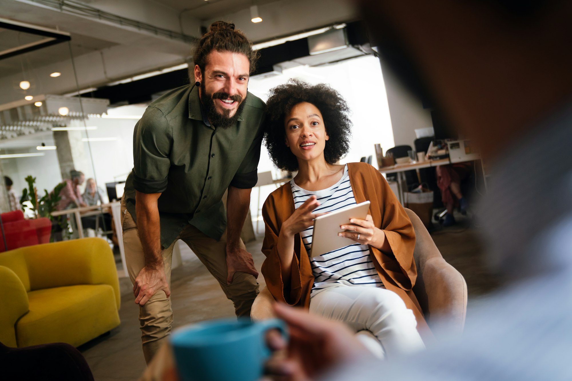 Portrait of creative business people team working together and smiling in office